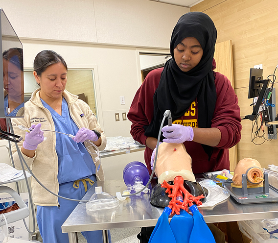 Student practicing intubation in a simulated environment