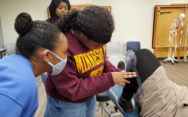 Pathways student getting hands-on learning about Physical Therapy