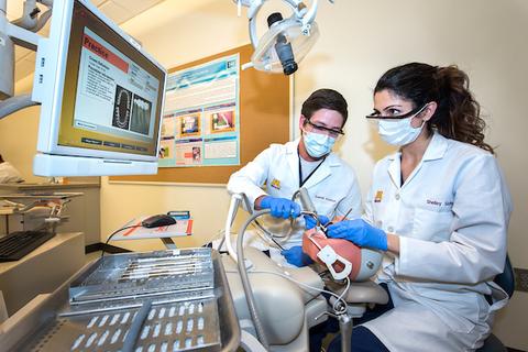 Dental faculty working in simulation center